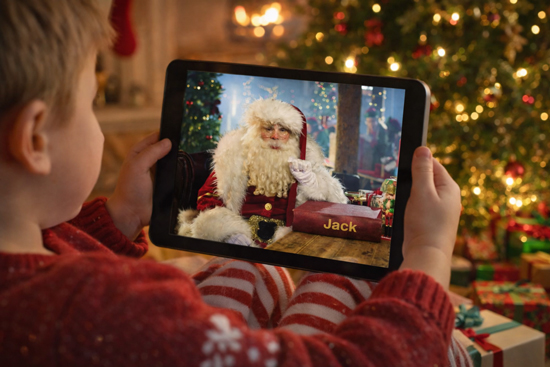 A child watching their personalised video from Santa on a tablet